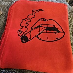 Red Blanket with Smoking Lips Design